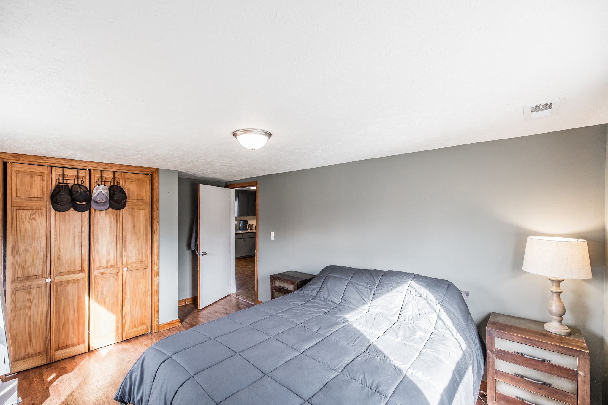 145 New Deal Potts Road Cottontown, TN 37048 - Photo 24 of 40 a bedroom with a bed and a lamp