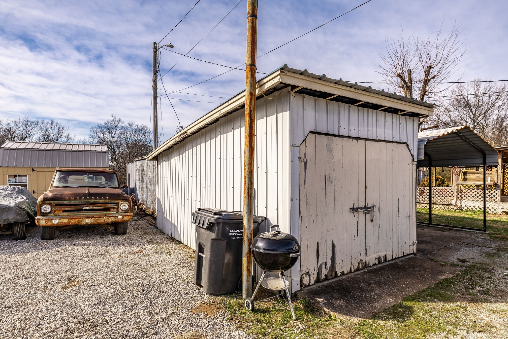 145 New Deal Potts Road Cottontown, TN 37048 - Photo 40 of 40 a backyard of a house with barbeque oven table and chairs