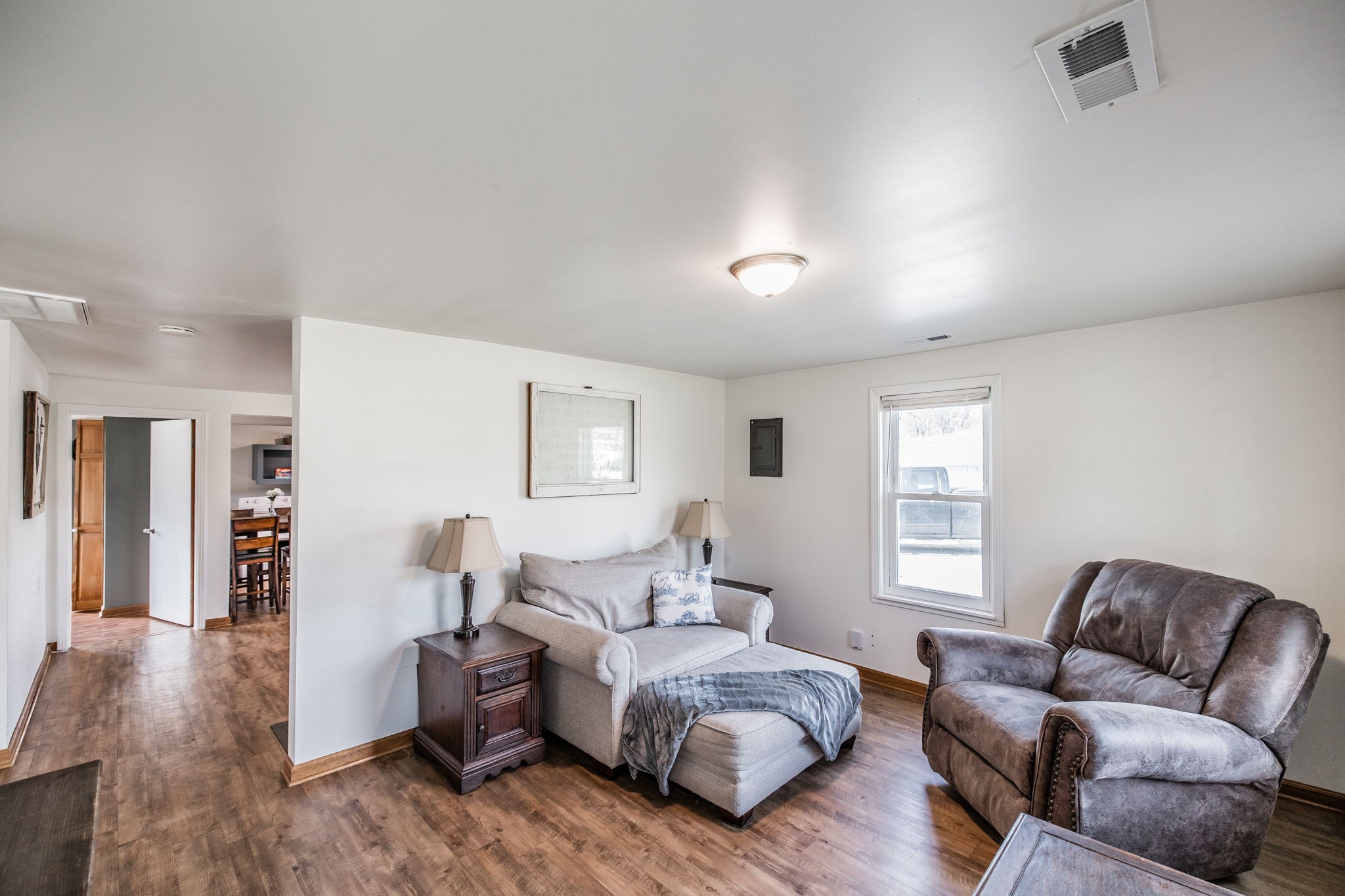 145 New Deal Potts Road Cottontown, TN 37048 - Photo 9 of 40 a spacious bedroom with a bed and wooden floor