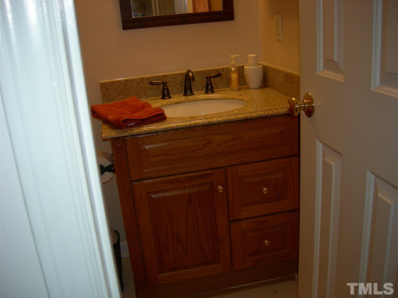 105 Galloway Court Raleigh, NC 27615 - Photo 12 of 30 Hall bath. Cabinet has granite countertop and wall medicine cabinet.