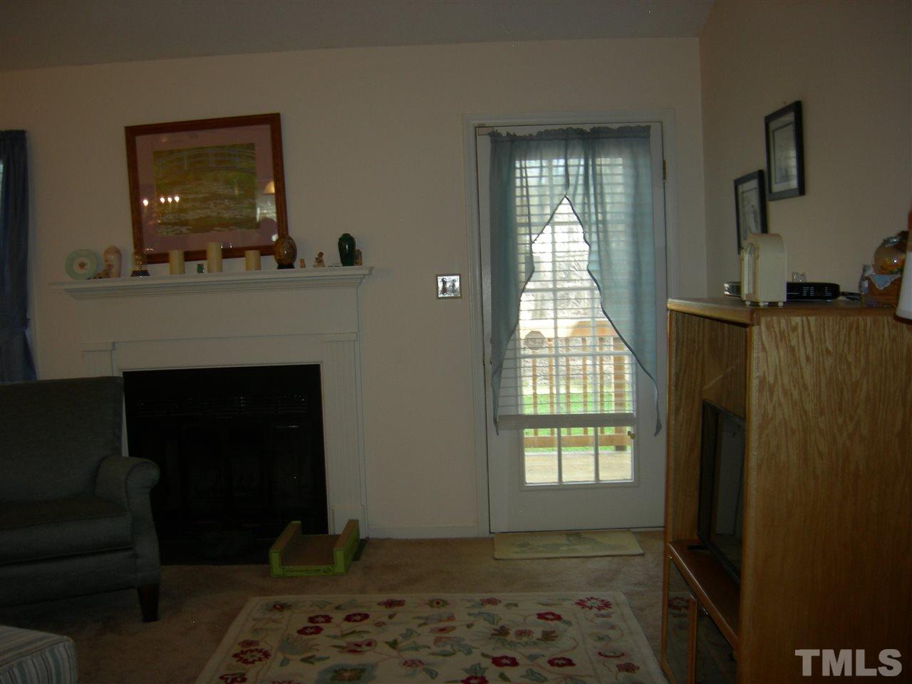105 Galloway Court Raleigh, NC 27615 - Photo 10 of 30 Fireplace and door to deck.