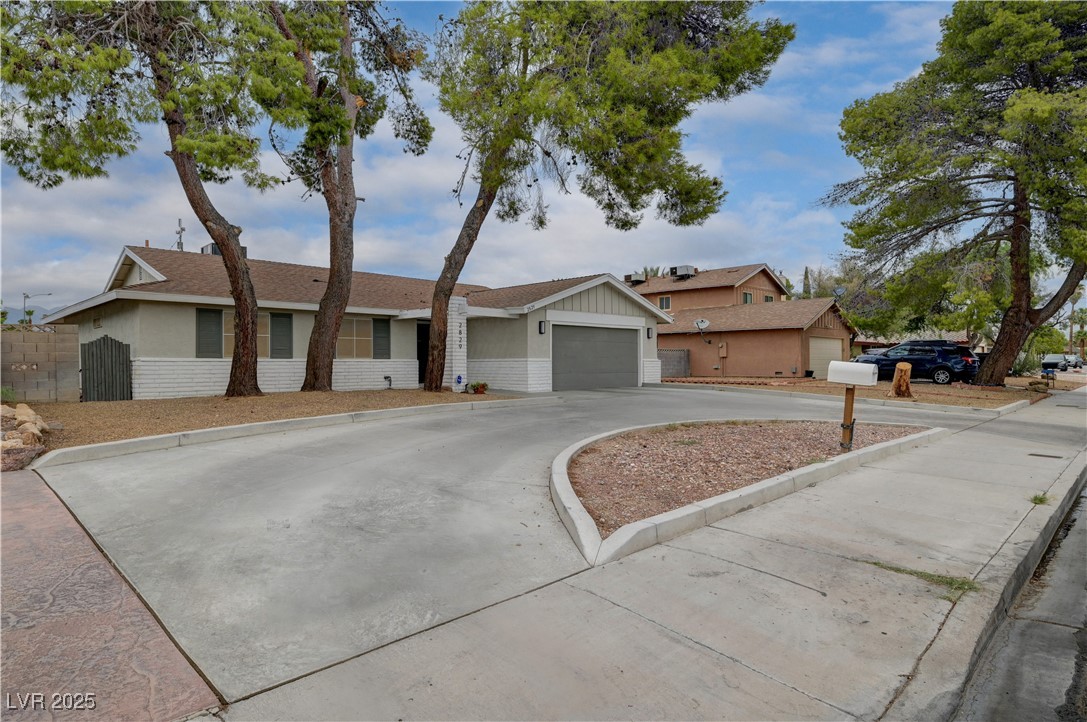 2829 Michael Way Las Vegas, NV 89108 - Photo 11 of 60 Ranch-style house with driveway and a shingled roof