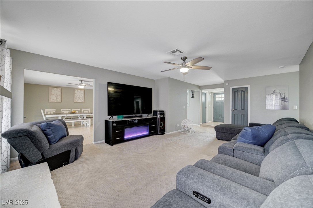 2829 Michael Way Las Vegas, NV 89108 - Photo 18 of 60 Living area with carpet flooring and ceiling fan