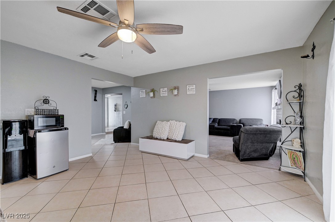 2829 Michael Way Las Vegas, NV 89108 - Photo 26 of 60 Living room with ceiling fan and light tile patterned floors