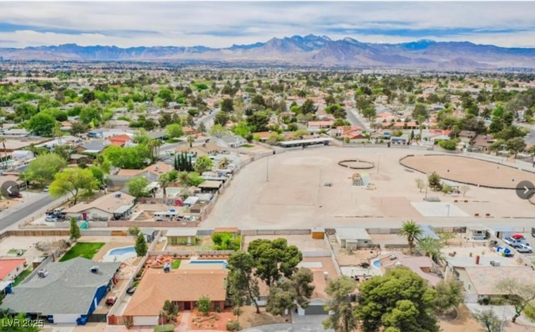 2829 Michael Way Las Vegas, NV 89108 - Photo 4 of 60 Aerial perspective of suburban area with a mountain backdrop