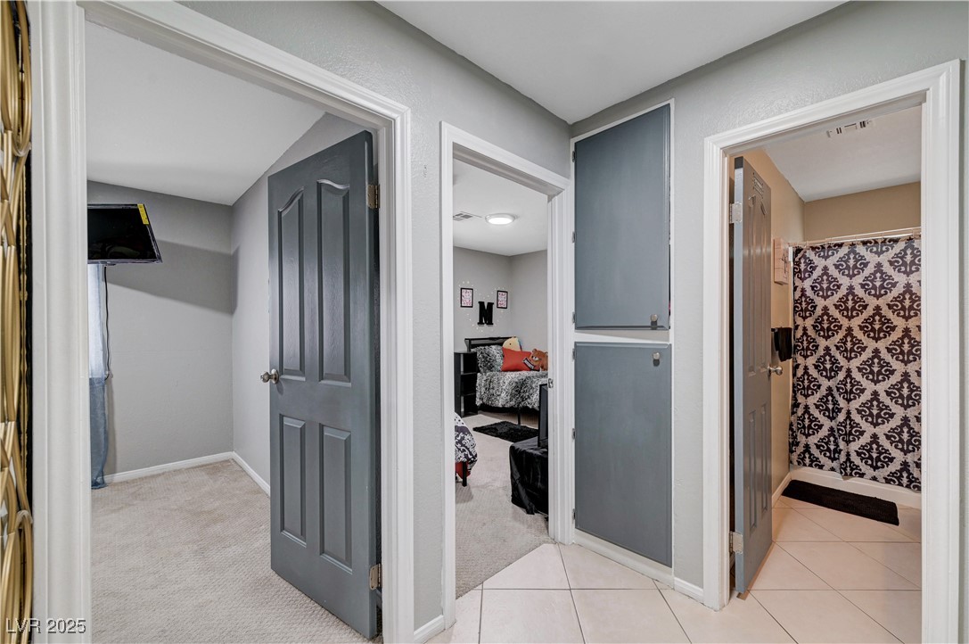 2829 Michael Way Las Vegas, NV 89108 - Photo 44 of 60 Hall featuring light carpet and light tile patterned floors