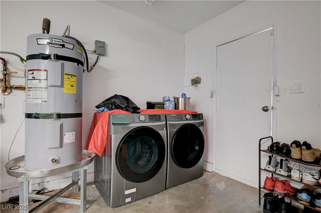 2829 Michael Way Las Vegas, NV 89108 - Photo 50 of 60 Washroom with strapped water heater and washing machine and dryer