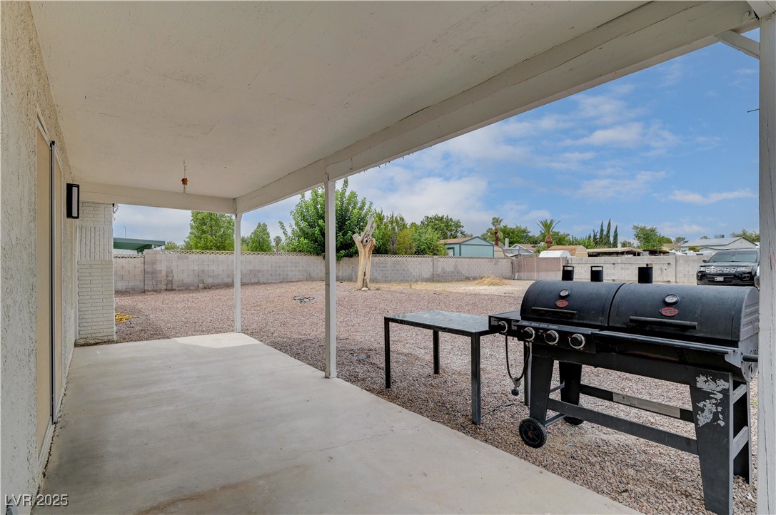 2829 Michael Way Las Vegas, NV 89108 - Photo 51 of 60 Fenced backyard with a patio and grilling area