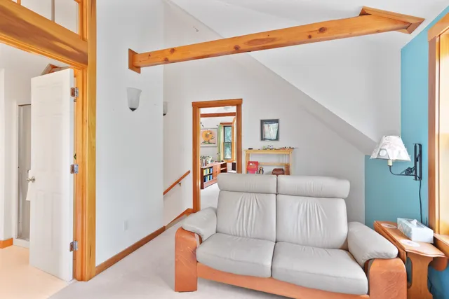 a bedroom with furniture and a window