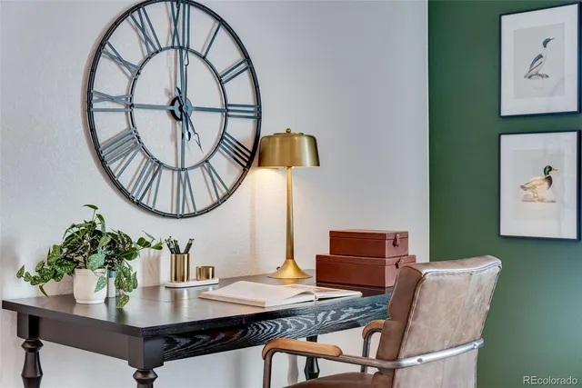 a view of a dining room with furniture and a potted plant