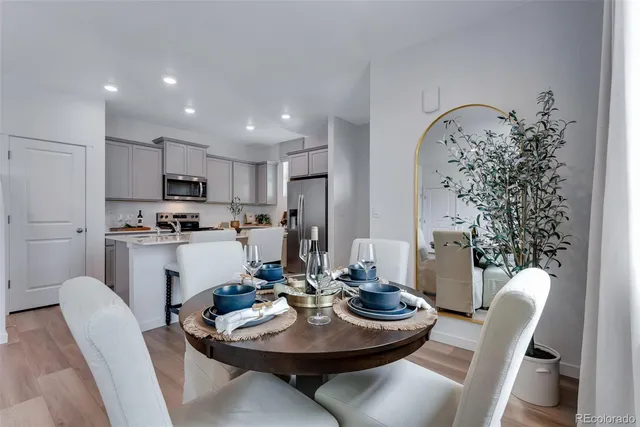 a kitchen with a table and chairs