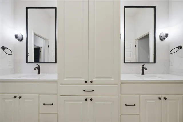 a utility room with sink dryer and washer