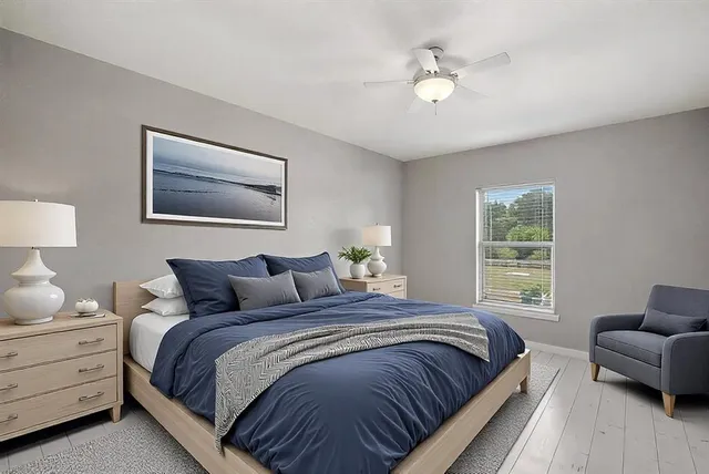 a bedroom with bed and window