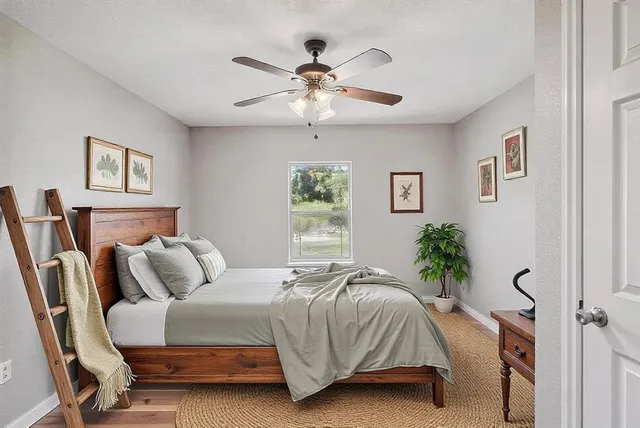 a bedroom with a bed and window