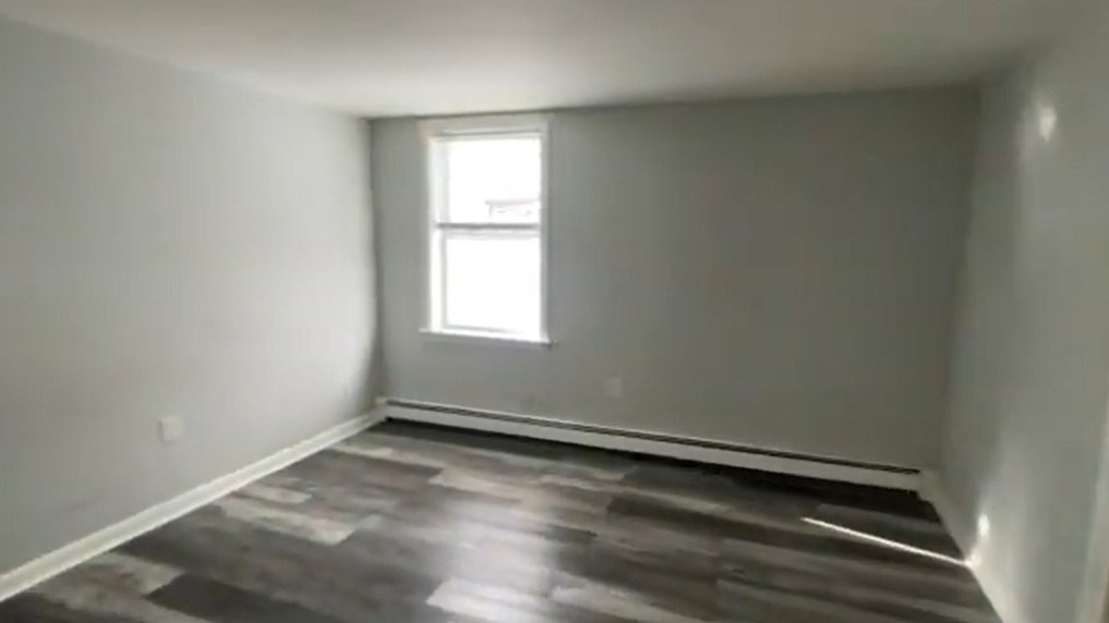 155 Onset Avenue, Unit E Wareham, MA 02558 - Photo 5 of 5 an empty room with a window