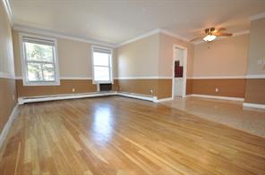 156 Centre Avenue, Unit 2E New Rochelle, NY 10805 - Photo 1 of 1 wooden floor in an empty room with a window