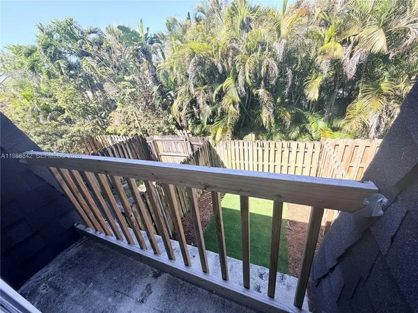a view of a porch with a tree