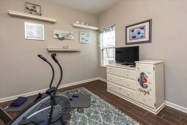 a view of a table and chairs under an umbrella