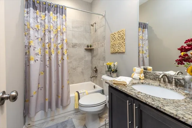 a view of a house with backyard sitting area and garden