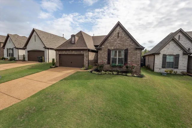 front view of a house with a yard