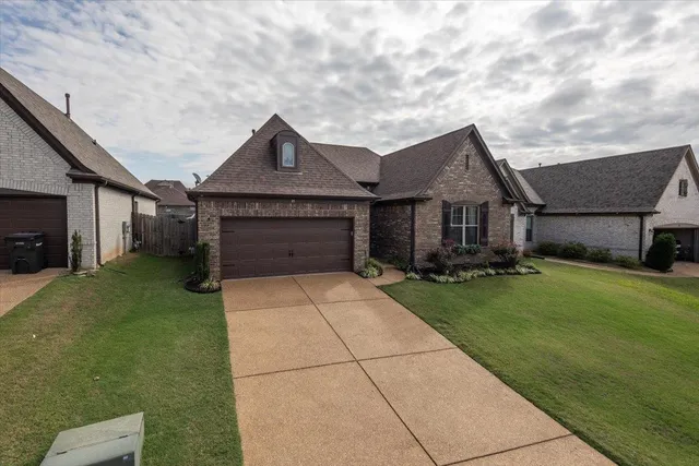 a kitchen with stainless steel appliances a dining table chairs stove and cabinets