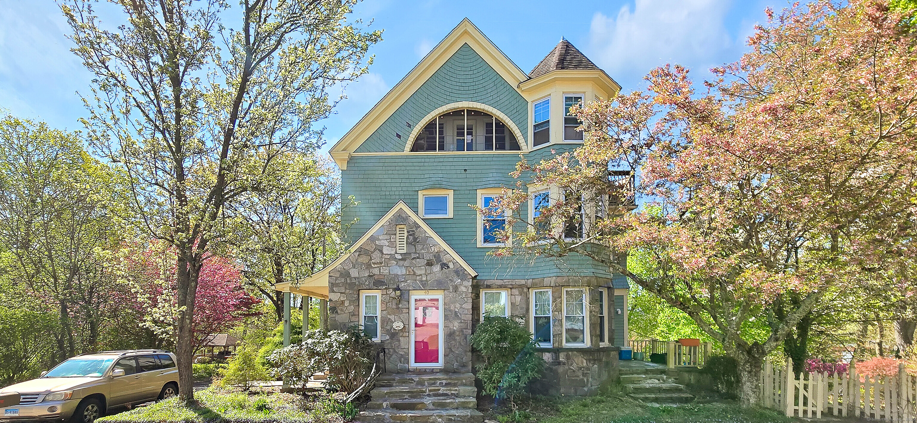 a front view of a house with garden
