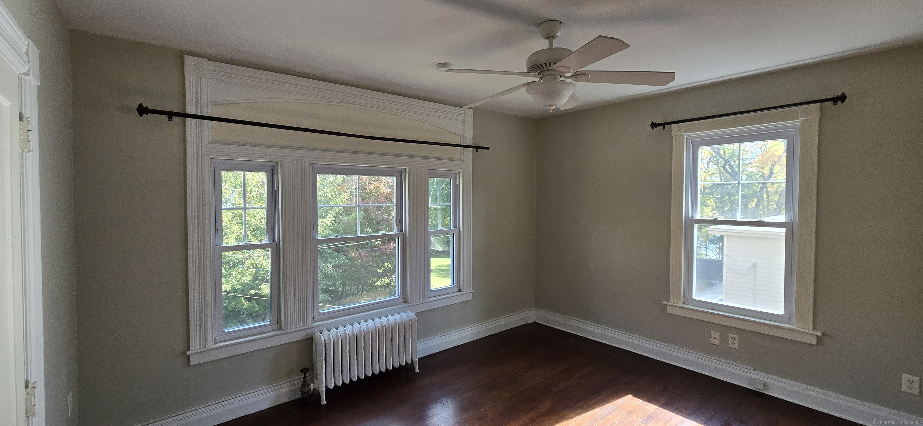 40 Maple Grove Avenue Norwich, CT 06360 - Photo 12 of 18 a view of an empty room with wooden floor and a window