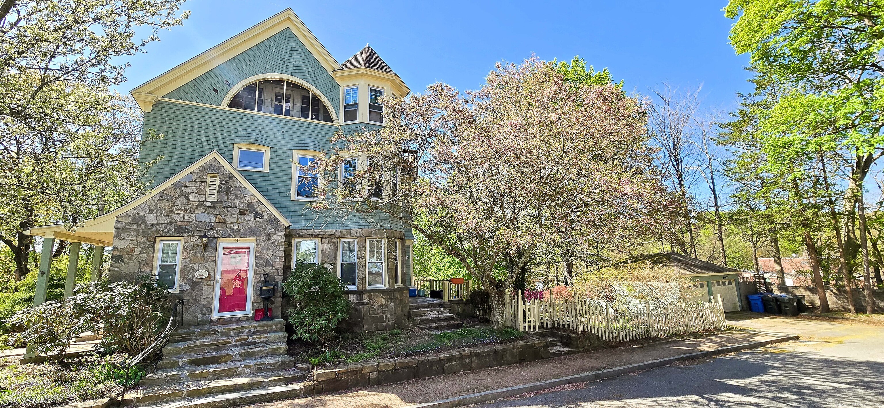 40 Maple Grove Avenue Norwich, CT 06360 - Photo 2 of 18 a front view of a house with a yard