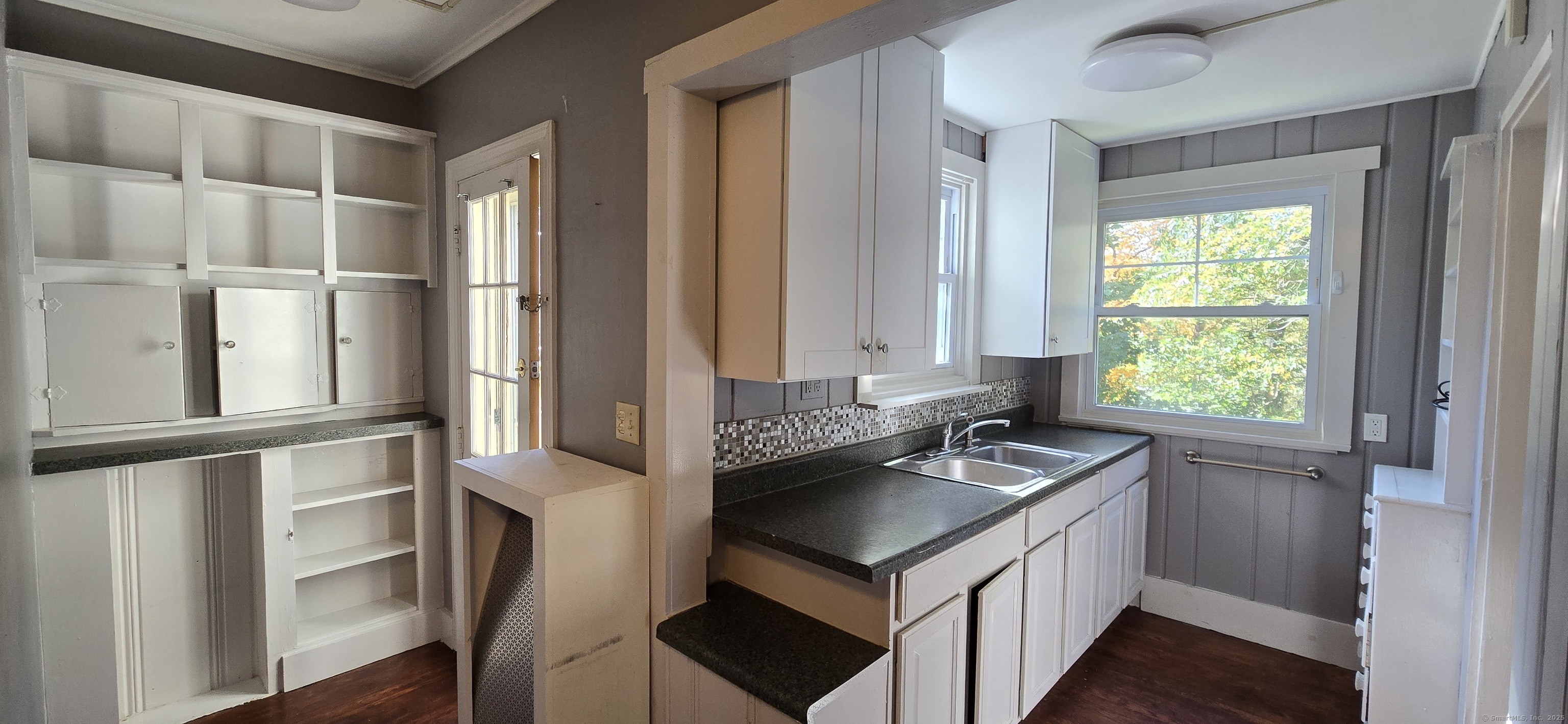 40 Maple Grove Avenue Norwich, CT 06360 - Photo 9 of 18 a kitchen with a sink cabinets and a window