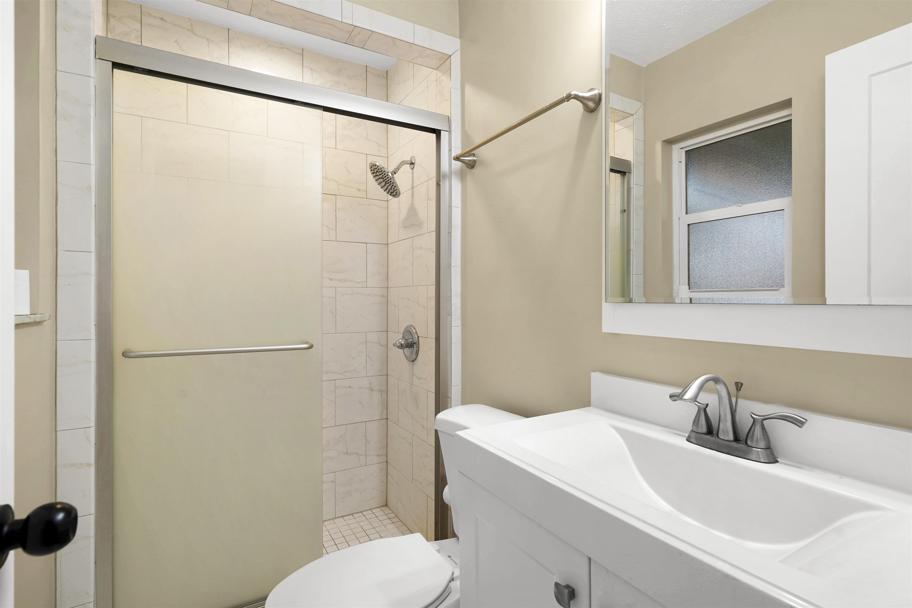 212 F Street St. Augustine, FL 32080 - Photo 17 of 35 a bathroom with a sink toilet and shower