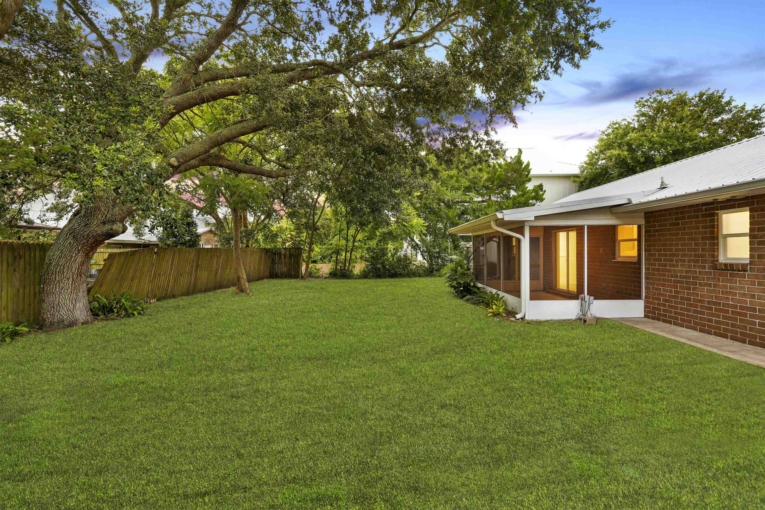 212 F Street St. Augustine, FL 32080 - Photo 30 of 35 a view of a backyard with a garden