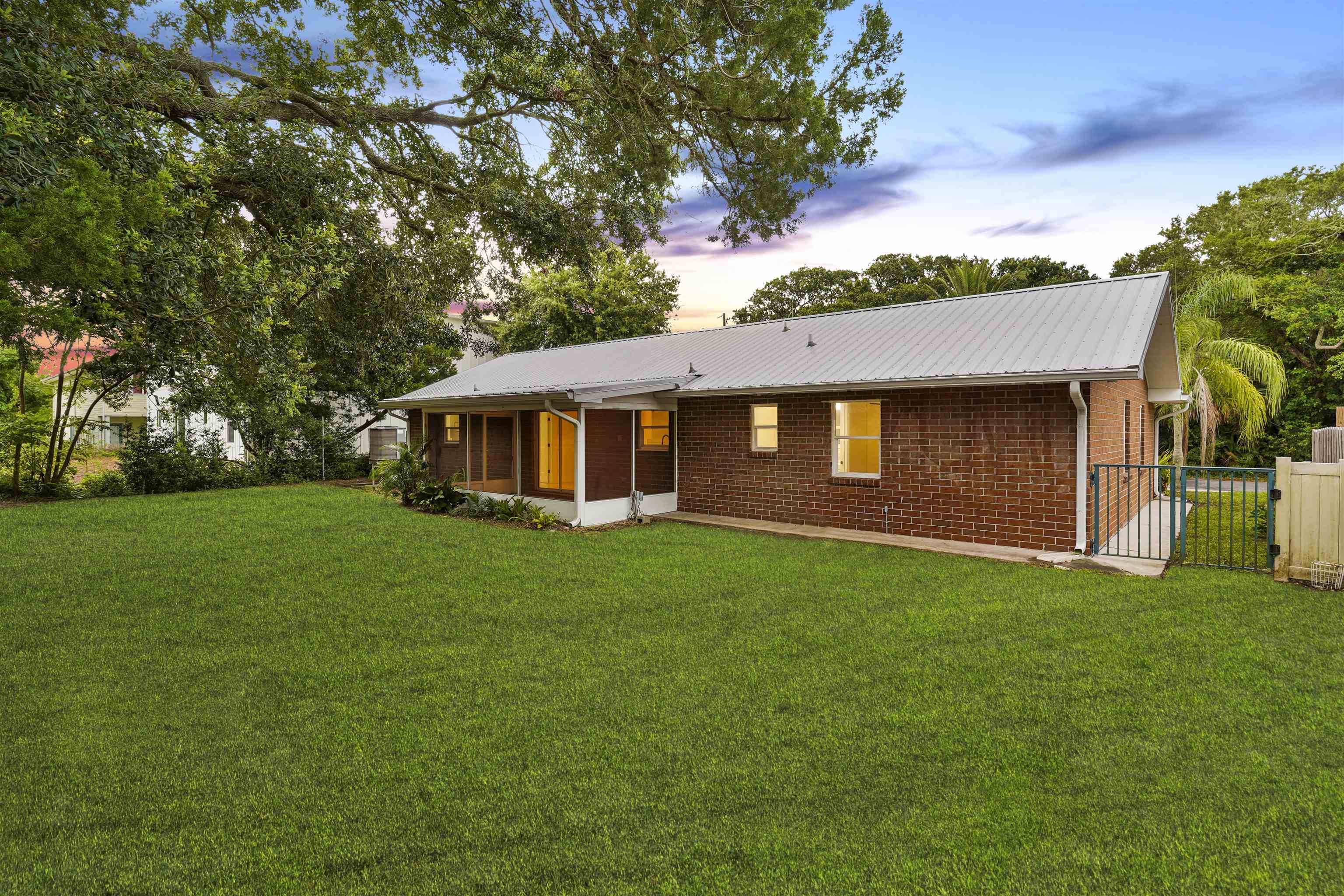 212 F Street St. Augustine, FL 32080 - Photo 6 of 35 a view of a house with a yard
