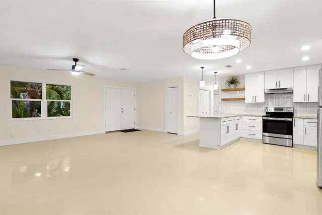 wooden floor in kitchen and a chandelier