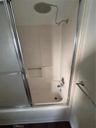 a bathroom with a granite countertop sink