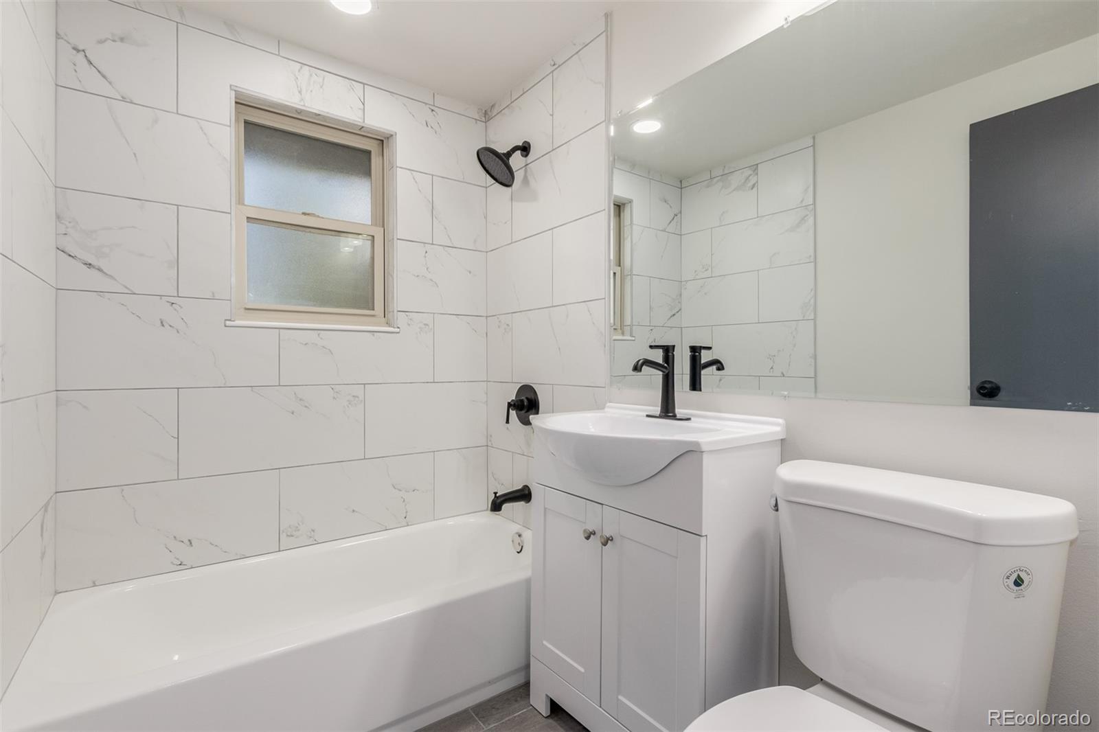 7330 Decatur Street Westminster, CO 80030 - Photo 20 of 37 a bathroom with a sink toilet and bathtub