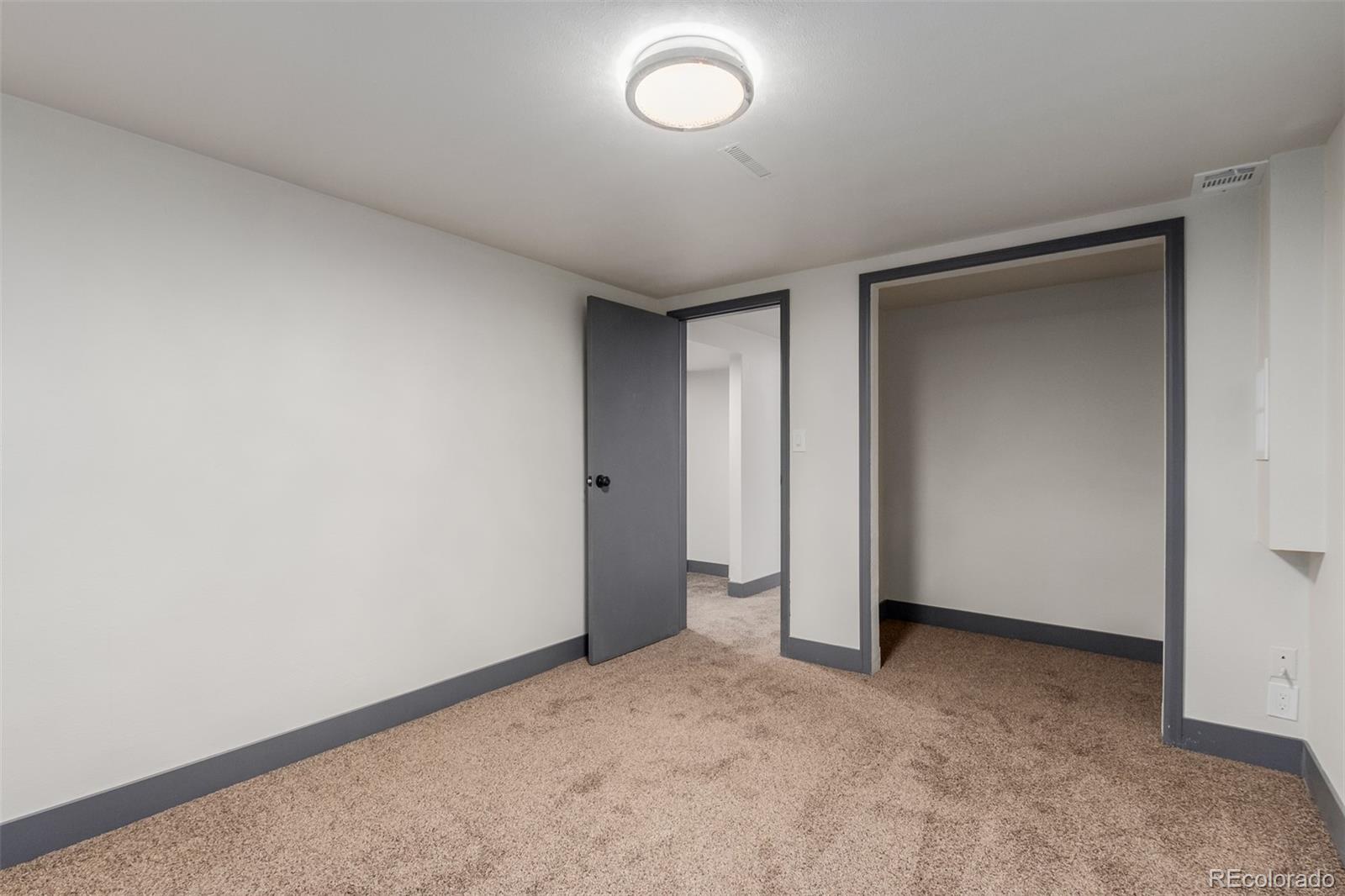 7330 Decatur Street Westminster, CO 80030 - Photo 28 of 37 a view of an empty room and a window