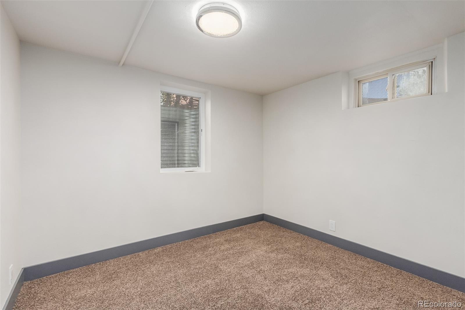 7330 Decatur Street Westminster, CO 80030 - Photo 29 of 37 an empty room with a window