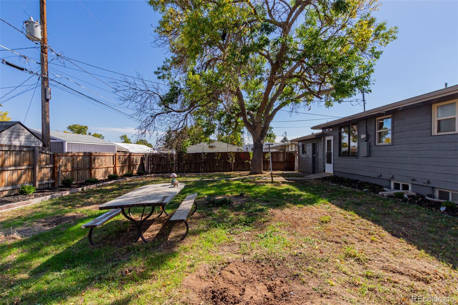 7330 Decatur Street Westminster, CO 80030 - Photo 35 of 37 a view of backyard with deck and outdoor seating