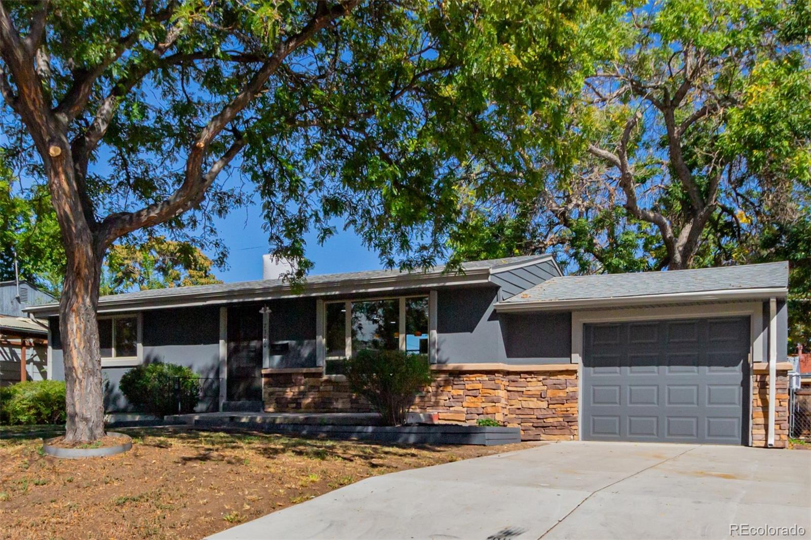 7330 Decatur Street Westminster, CO 80030 - Photo 6 of 37 front view of a house with a patio