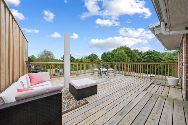 a view of roof deck with couches