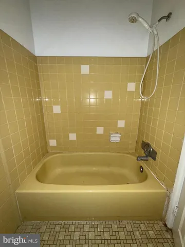 a bathroom with a bath tub
