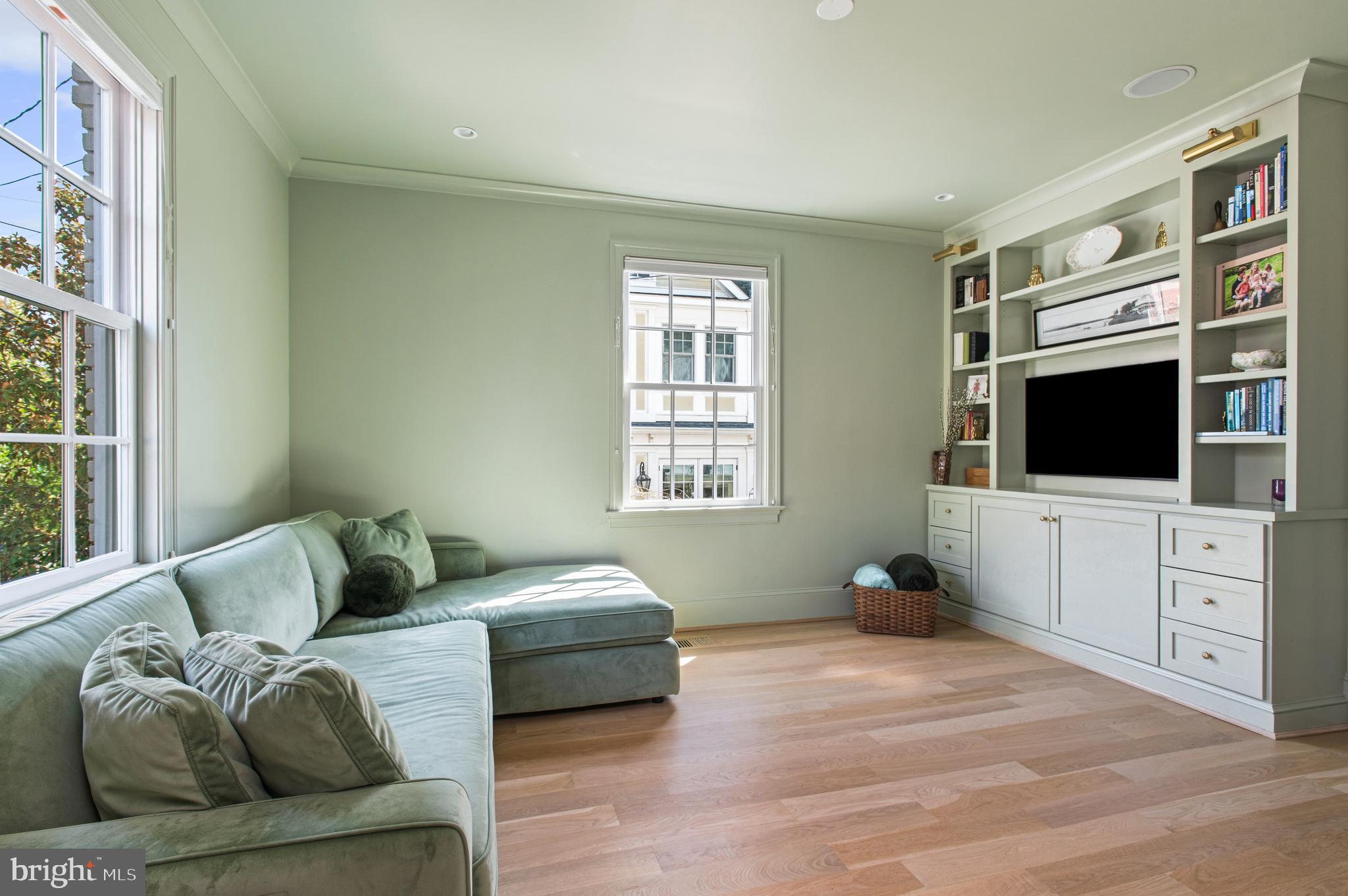 3312 Lowell Street Northwest Washington, DC 20008 - Photo 11 of 44 a bedroom with furniture and a flat screen tv