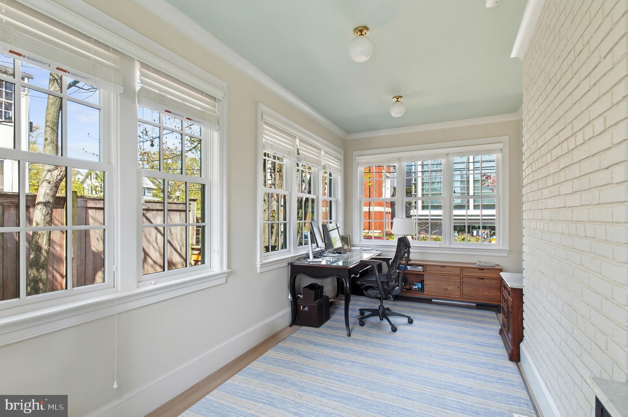 3312 Lowell Street Northwest Washington, DC 20008 - Photo 13 of 44 a view of a workspace with furniture and a window