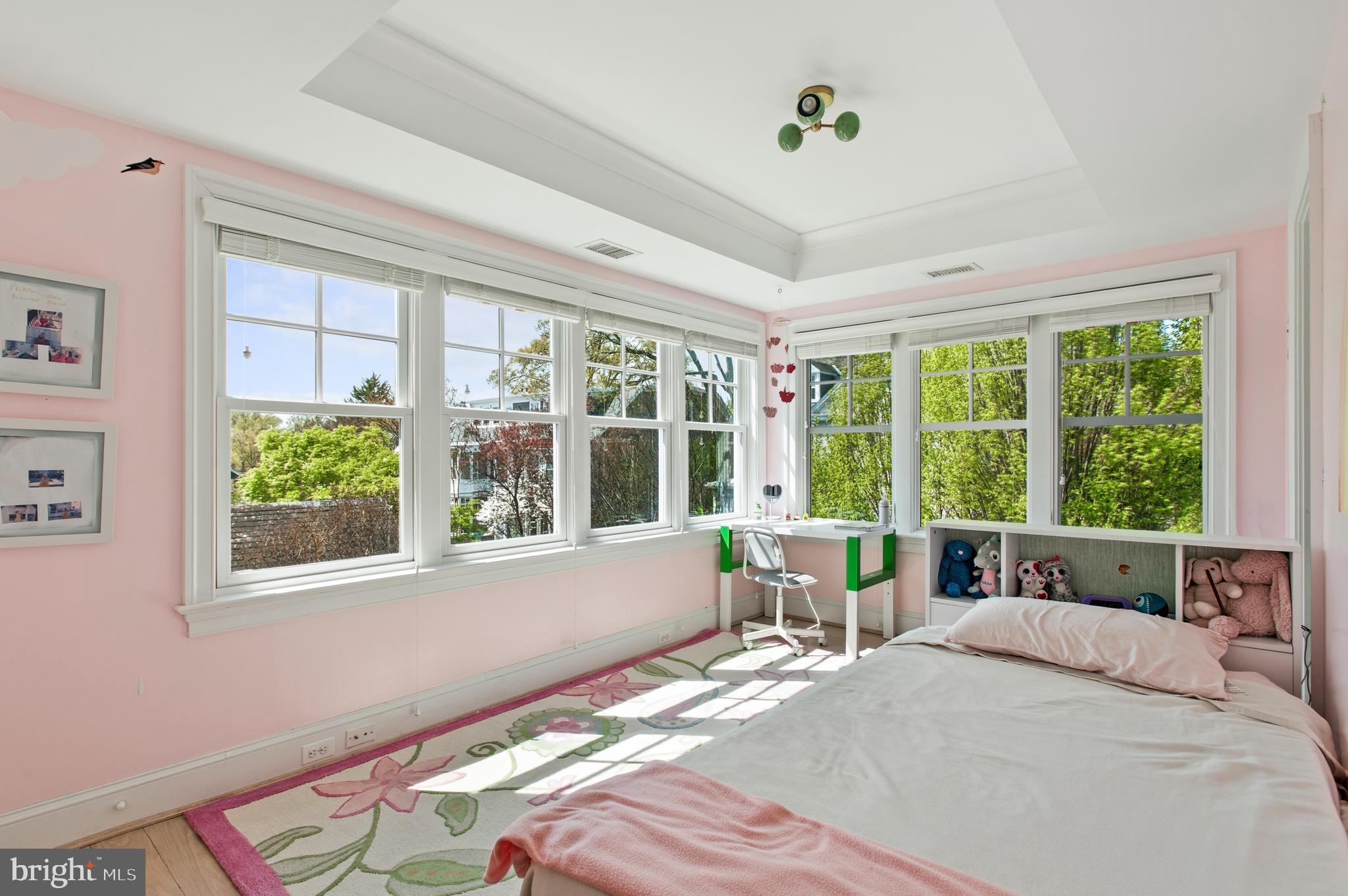 3312 Lowell Street Northwest Washington, DC 20008 - Photo 20 of 44 a bedroom with a bed and a large window