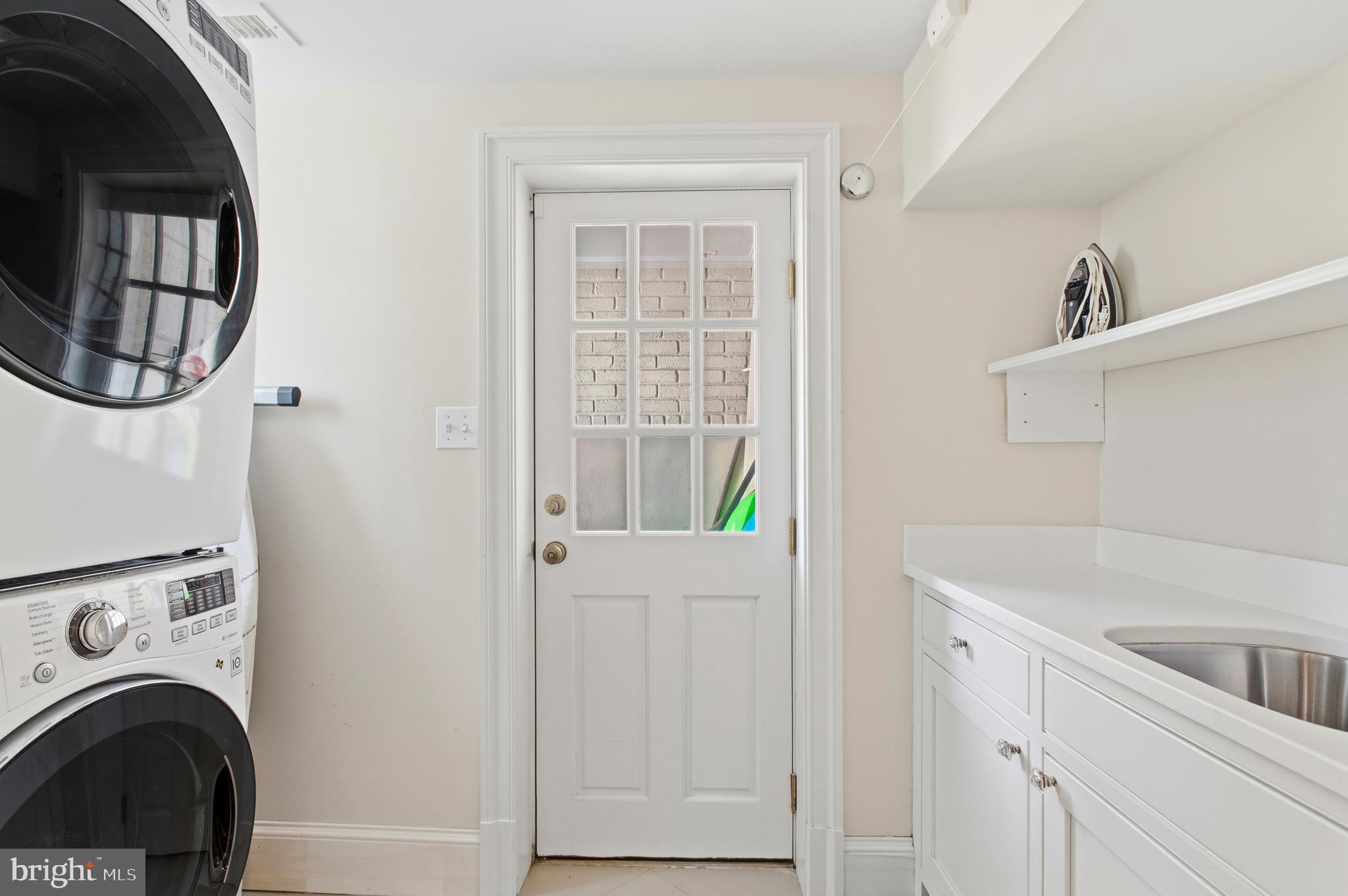 3312 Lowell Street Northwest Washington, DC 20008 - Photo 35 of 44 a view of a kitchen with washer and dryer