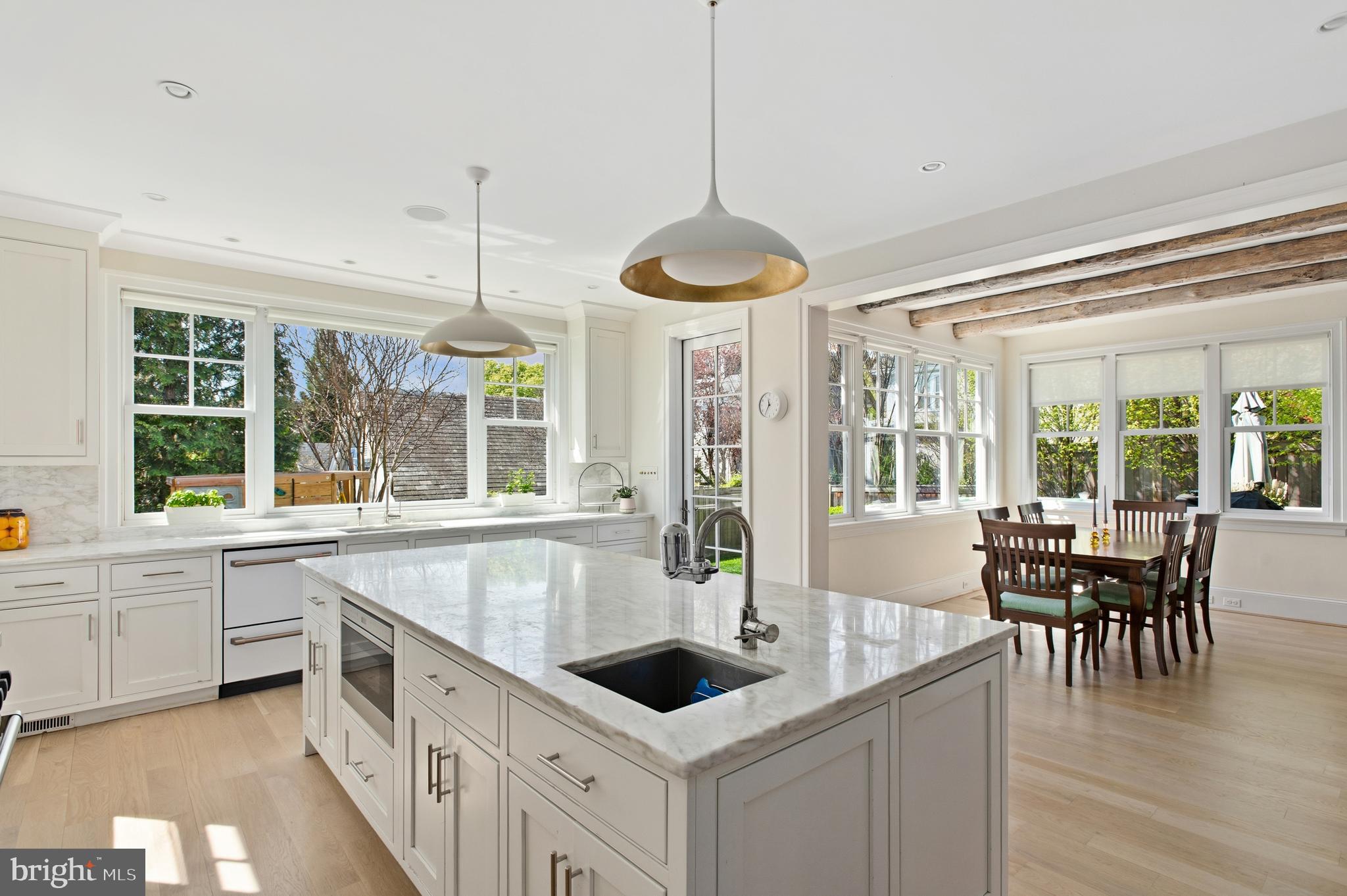 3312 Lowell Street Northwest Washington, DC 20008 - Photo 4 of 44 a large white kitchen with a large window