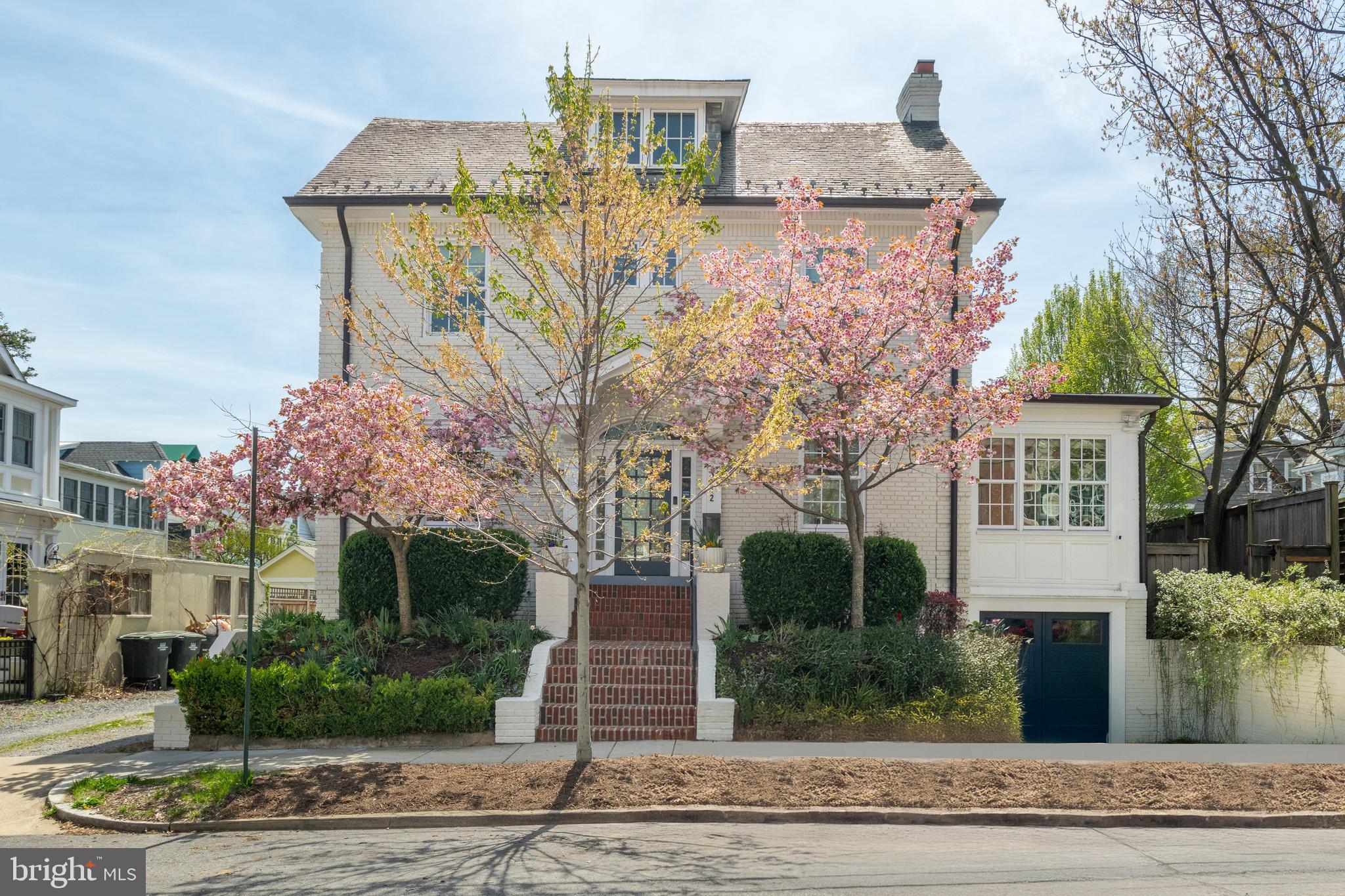 3312 Lowell Street Northwest Washington, DC 20008 - Photo 43 of 44 a front view of a house with garden