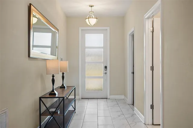 a view of a livingroom with furniture and windows