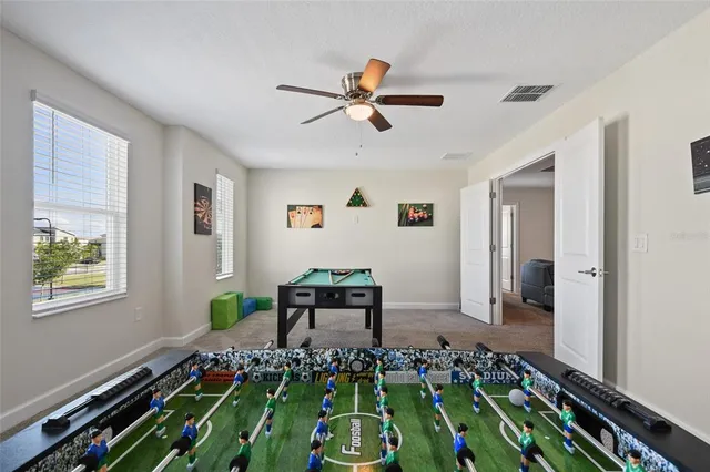 a bedroom with a bed and a book shelf