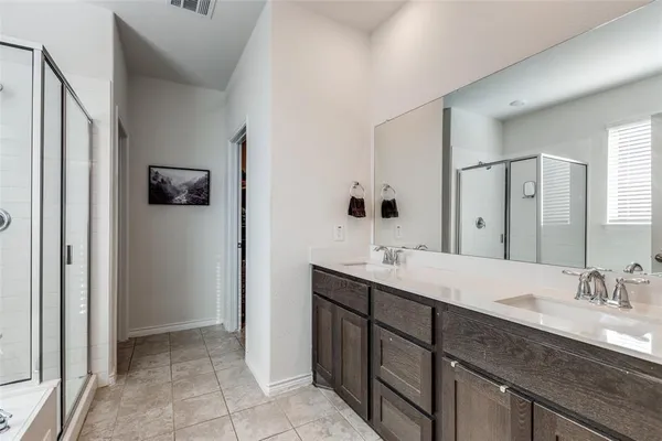 a bathroom with a granite countertop sink mirror and double